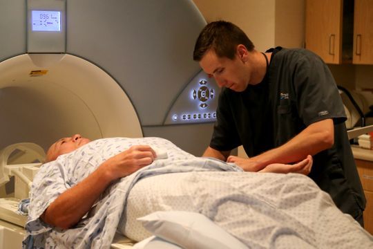 Bob Rulli, undergoes an MRI scan, administered by technologist Lance Miller, right, Tuesday, July 3, 2018, at Good Samaritan Hospital in Clifton.